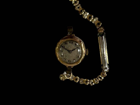 Ladies 9 carat gold watch with plated bracelet.