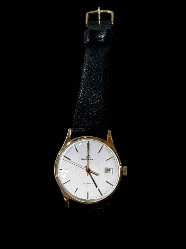 Garrard 9 carat gold gents watch.