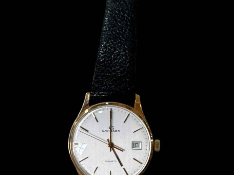 Garrard 9 carat gold gents watch.