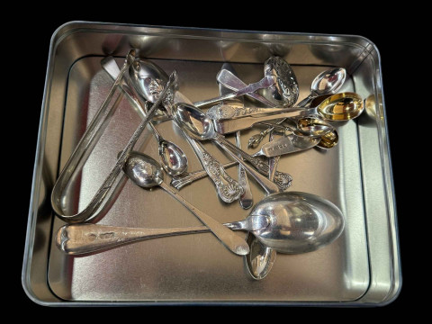 Collection of silver spoons, bright cut tongs, sifting spoon and butter...