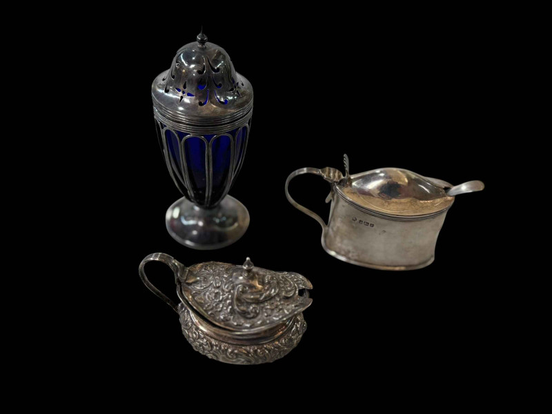 Two silver mustard pots and silver caster with blue glass liner (3).