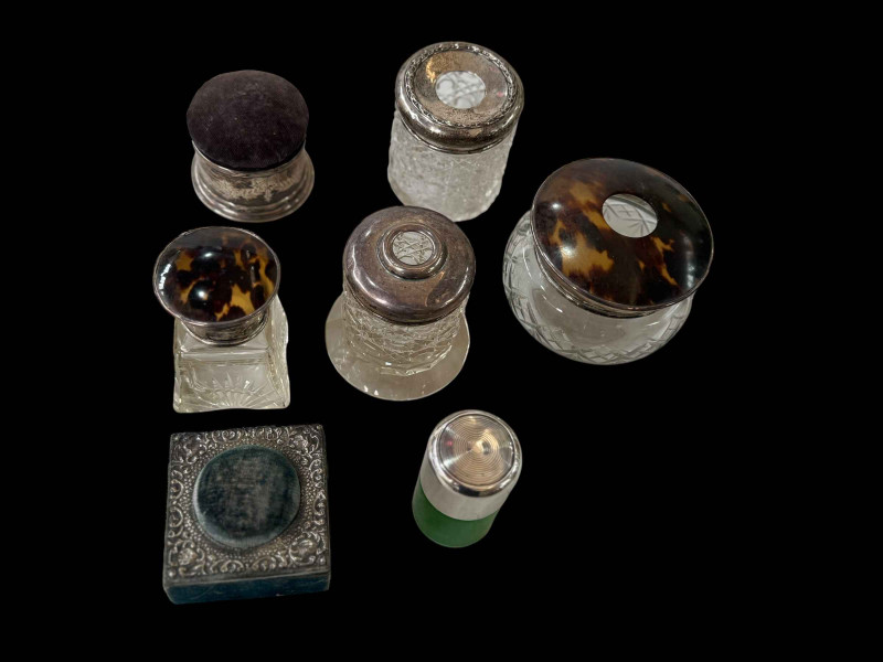 Five silver mounted/topped toilet bottles and two silver mounted pin cushions (7).