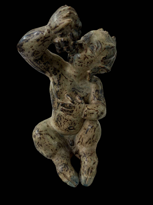 Large Knud Kyhn Royal Copenhagen sitting faun, 33cm.