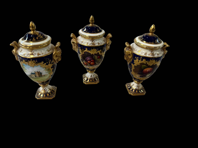 Three small Coalport limited edition vases, one painted with castle and two painted with fruit by M Harnet.