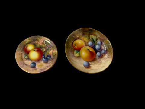 Two small Royal Worcester fruit painted pin trays, one signed Freeman...