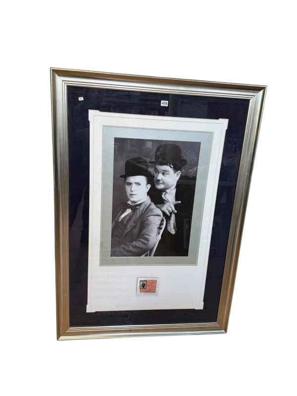 Laurel & Hardy signed presentation with a framed photographic reprint, 132.5cm by 93.5cm including frame, COA verso.