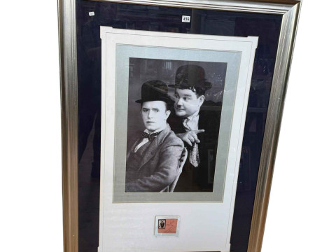 Laurel & Hardy signed presentation with a framed photographic reprint,...