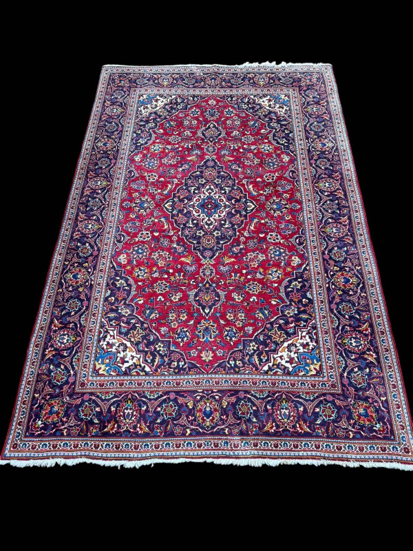 Persian floral decorated carpet with central medallion, 3.20 by 1.96.