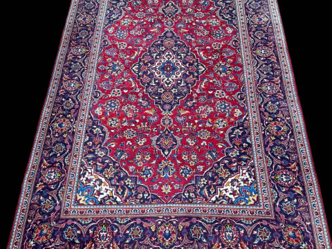 Persian floral decorated carpet with central medallion, 3.20 by 1.96.