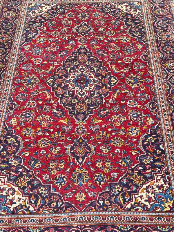 Persian floral decorated carpet with central medallion, 3.20 by 1.96.