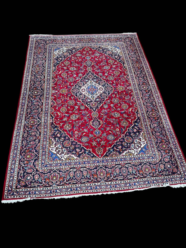 Persian floral decorated carpet with central medallion, 3.40 by 2.40.
