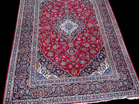Persian floral decorated carpet with central medallion, 3.40 by 2.40.