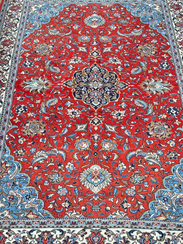 Persian floral decorated carpet with central medallion, 2.82 by 1.95.