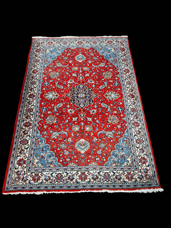 Persian floral decorated carpet with central medallion, 2.82 by 1.95.
