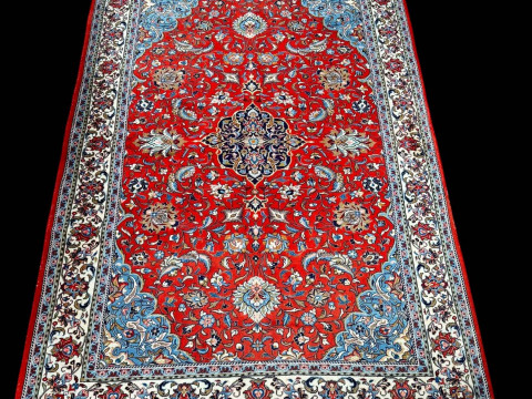 Persian floral decorated carpet with central medallion, 2.82 by 1.95.