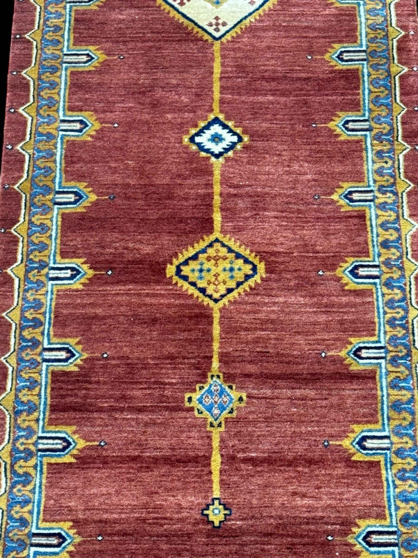 Pair rust ground Persian runners, 3.00 by 0.78.