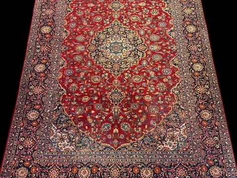 Persian floral decorated carpet with central medallion, 3.70 by 2.60.