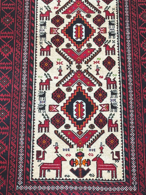 Persian design rug with antlered animal decoration, 2.00 by 0.96.