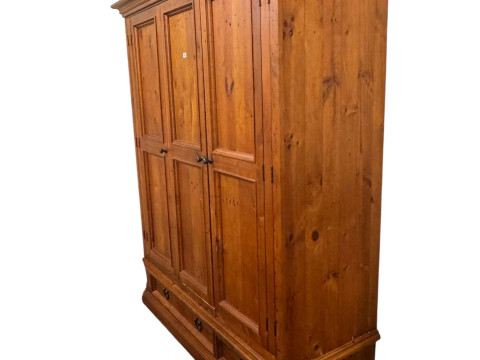 Pine triple wardrobe with two base drawers, 202cm by 167cm by 63cm.
