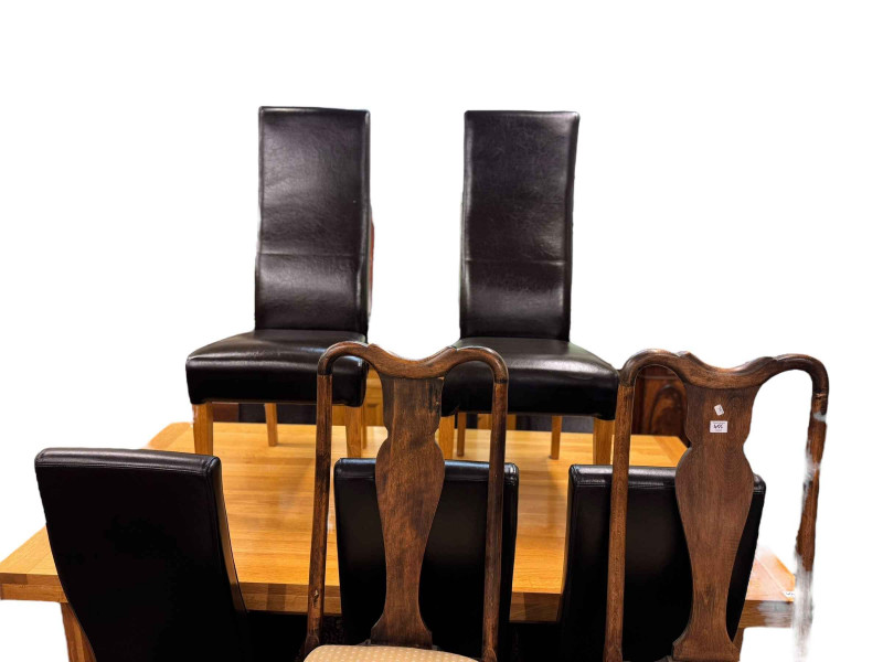 Contemporary light oak eleven piece dining suite comprising three door sideboard, wall mirror, rectangular extending dining table with two integral leaves and set of eight faux leather high back dining chairs.