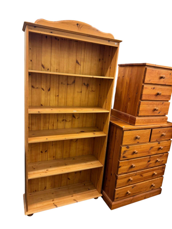Five piece pine bedroom suite comprising two door wardrobe with two base drawers, dressing table, dressing stool, six drawer chest, three drawer pedestal, double and single bedsteads and five tier open bookcase (8).