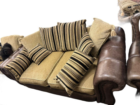 Brown studded leather and fabric five piece lounge suite comprising two seater settee, two chairs, large chair and footstool (some of the legs are not affixed and need attention). thumbnail