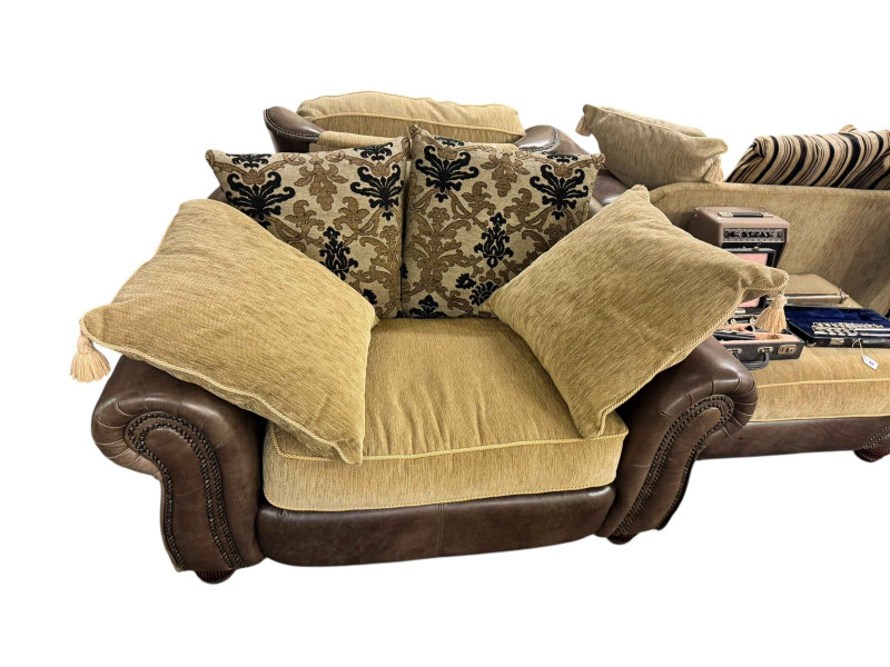 Brown studded leather and fabric five piece lounge suite comprising two seater settee, two chairs, large chair and footstool (some of the legs are not affixed and need attention).