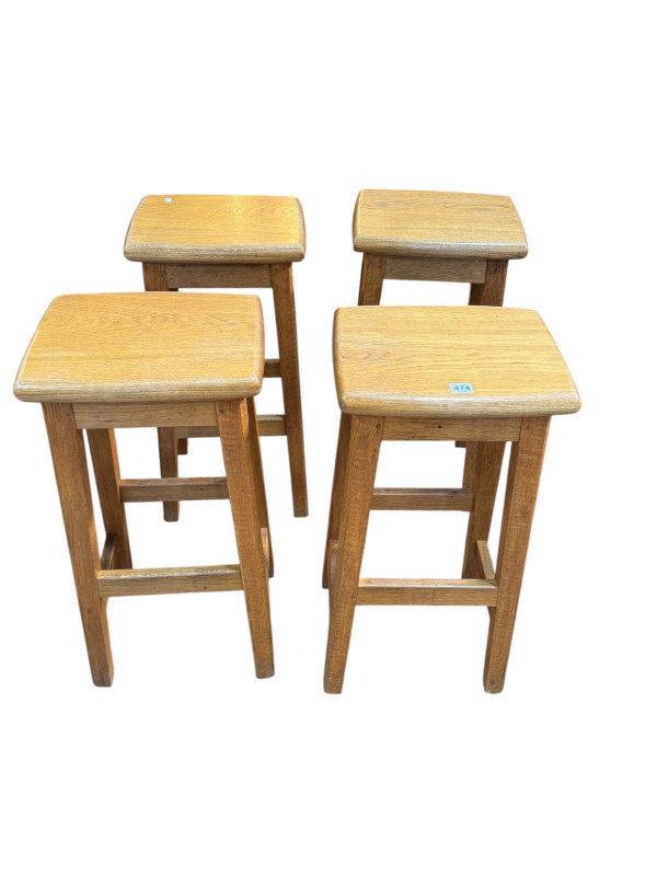 Set of four oak bar stools with Lizard motif, 72cm by 36cm by 29cm.