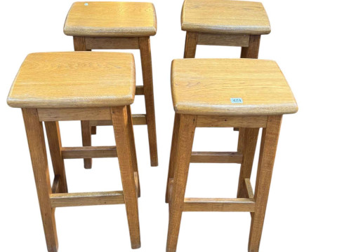 Set of four oak bar stools with Lizard motif, 72cm by 36cm by 29cm.