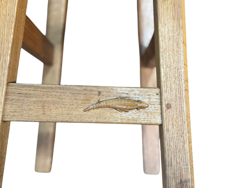 Set of four oak bar stools with Lizard motif, 72cm by 36cm by 29cm.