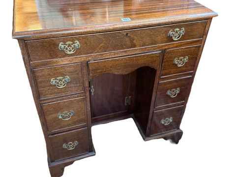 Georgian style mahogany eight drawer kneehole desk having lower inset...