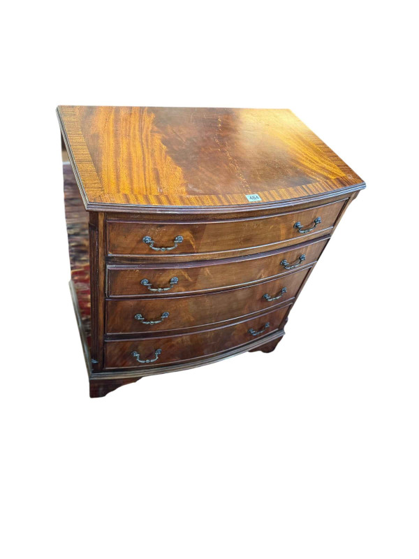 Mahogany crossbanded bow front chest of four long drawers, 77.5cm by 69cm by 44cm.