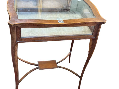 Edwardian mahogany and line inlaid bijouterie table of serpentine form...