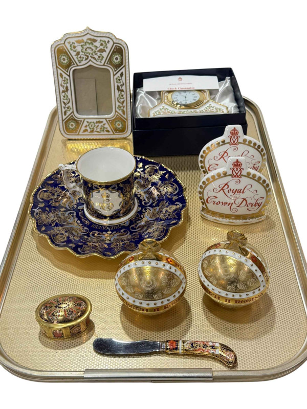 Collection of Royal Crown Derby including Green Derby clock and photograph frame, Queen Mother plate and mug, two paperweights, two adverts, pill box and knife.