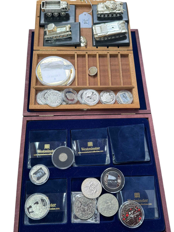 Four models by Denzil Skinner & Co Ltd, commemorative crowns, capsulated coins, 2019 silver sovereign, etc.