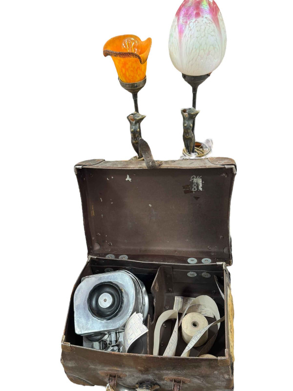 Two retro lady figural table lamps and a bus conductors machine.