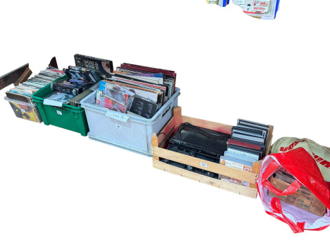 Four boxes of LP records, 45 singles, DVD's and a PS2 with games.