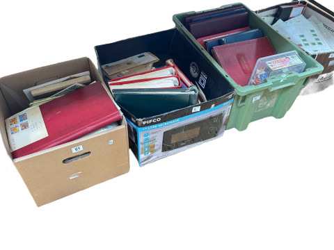 Four boxes of stamps, albums, etc.