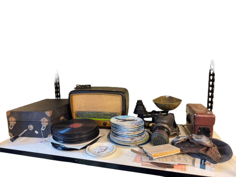 May Fair gramophone, pilots goggles and hat, gas mask, Salter scales with...