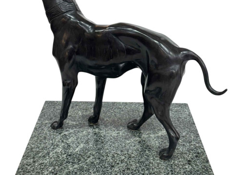 Bronzed Whippet dog on marble plinth.