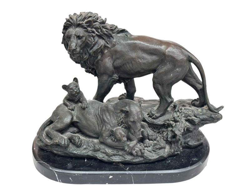 Impressive bronze group depicting a lion, lioness and their cubs on a marble plinth.