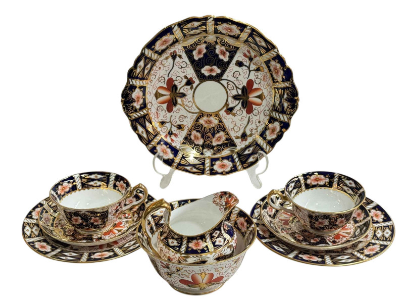Royal Crown Derby Imari tea set comprising twelve cups, saucers and plates, sugar and cream, cake plate, small vase and two pin dishes, 42 pieces.