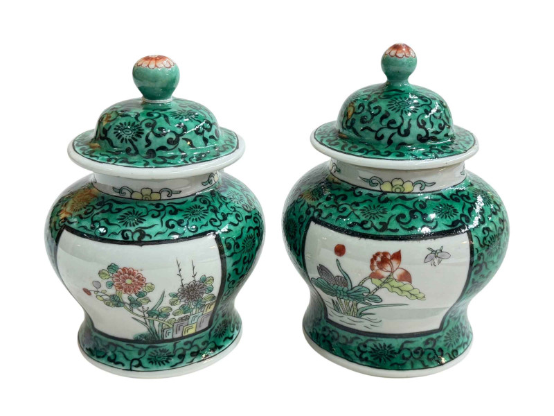 Pair Oriental ginger jars with floral decoration on green ground, 17cm.