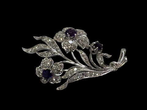 Amethyst and diamond white gold floral brooch, well constructed and having...