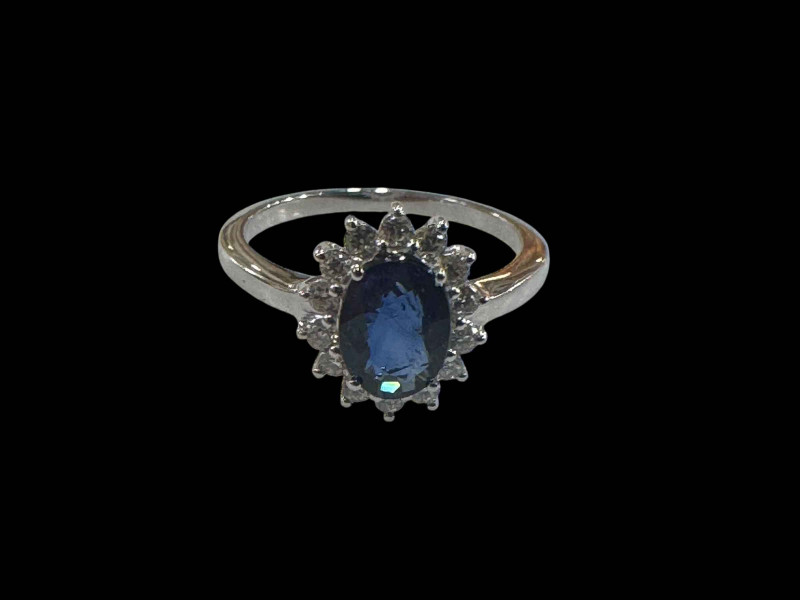 18 carat white gold oval sapphire and diamond cluster ring, size O.