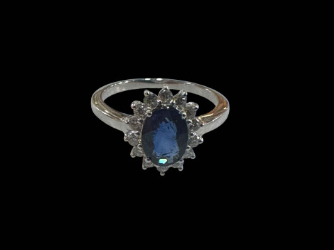 18 carat white gold oval sapphire and diamond cluster ring, size O.