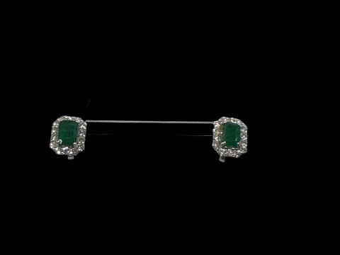Pair of emerald and diamond cluster earrings, each rectangular emerald...
