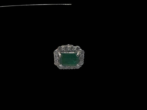 Pair of emerald and diamond cluster earrings, each rectangular emerald surrounded by fourteen diamonds set in 18 carat white gold, emerald 2.04 carats, diamond 0.85 carats. thumbnail