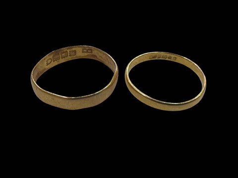 Two 22 carat gold band rings.
