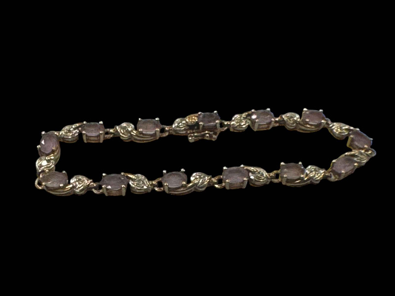 9 carat gold, amethyst and diamond bracelet.